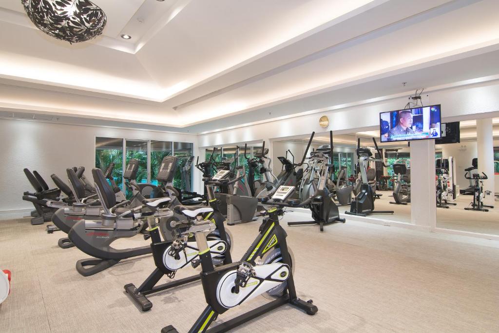 A mirrored cardio studio dominated by exercise bikes, ellipticals and treadmills.