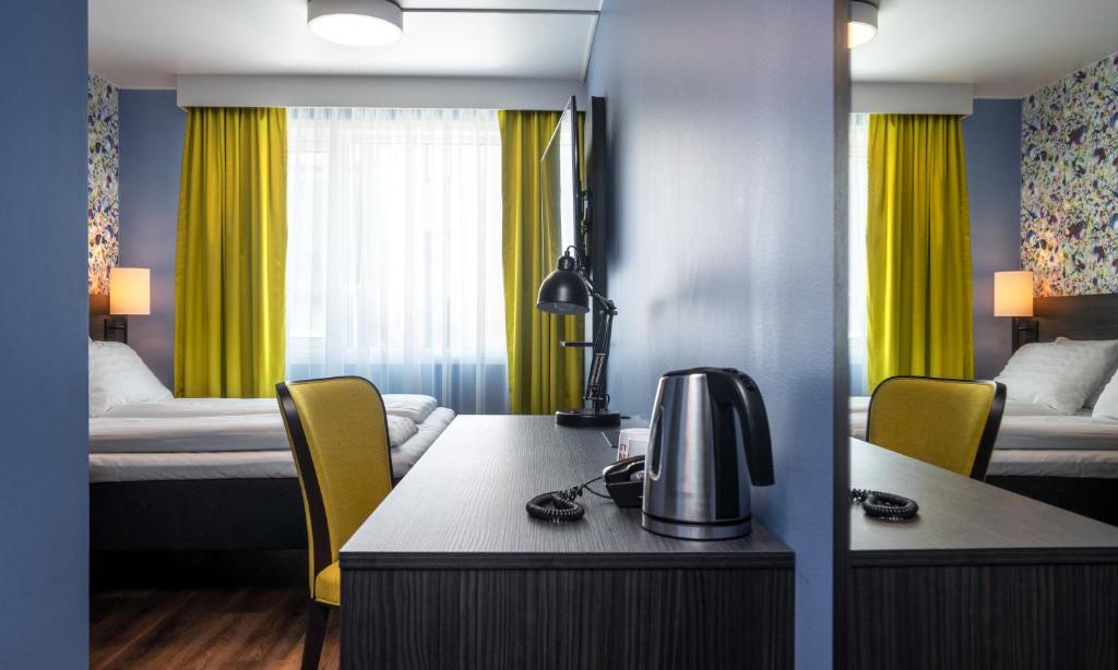 Postel nebo postele na pokoji v ubytování Thon Hotel Tromsø