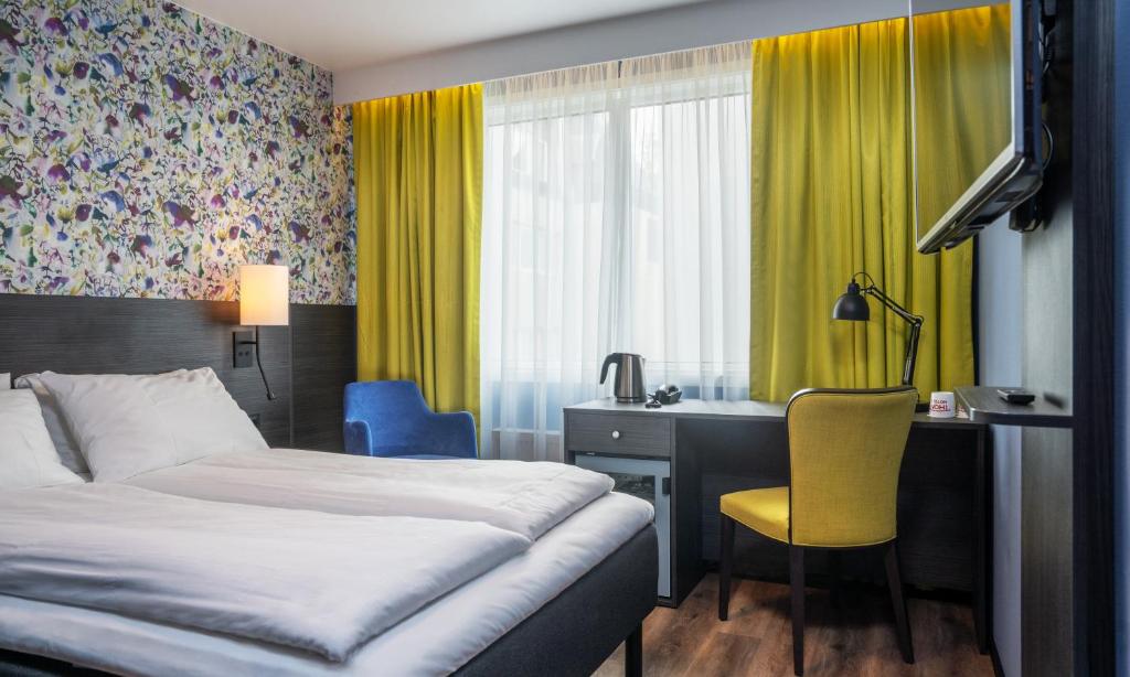 Postel nebo postele na pokoji v ubytování Thon Hotel Tromsø