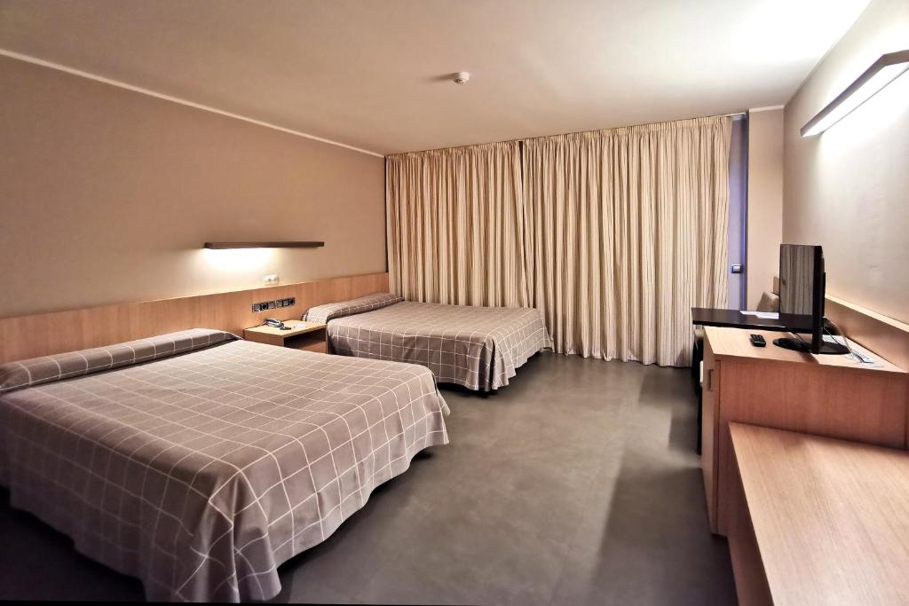 Postel nebo postele na pokoji v ubytování Hotel Acuazul