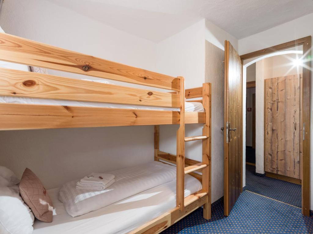 a bunk bed room with two bunk beds in it at Haus Tirol in Brixen im Thale
