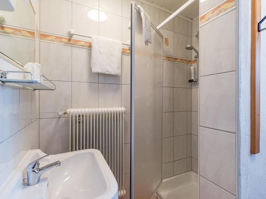 a bathroom with a sink and a shower at Haus Tirol in Brixen im Thale
