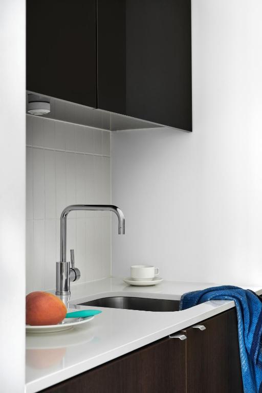 Kuchyň nebo kuchyňský kout v ubytování Dandenong Central Apartments Official
