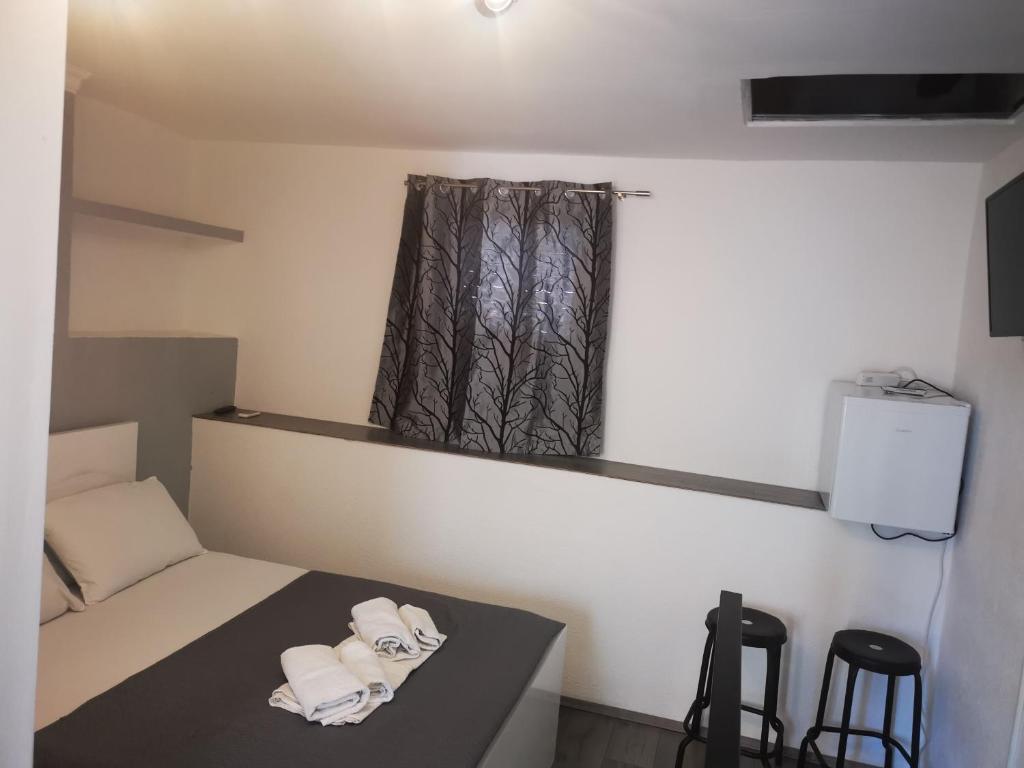 Postel nebo postele na pokoji v ubytování Rooms Pama