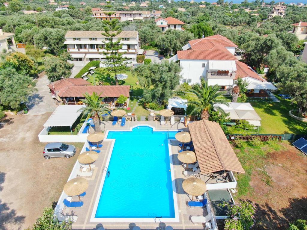an aerial view of a resort swimming pool with umbrellas at Alexaria Holidays Homes in Lefkada