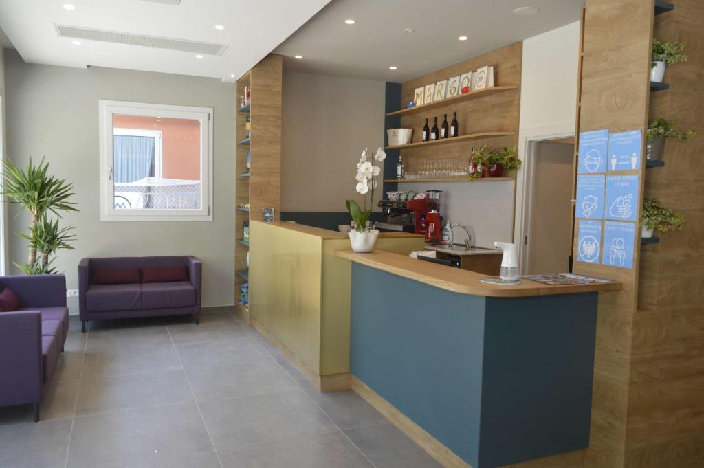 a lobby with a counter in a room at MAR60 Apartments in Caorle