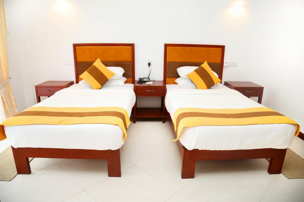 Postel nebo postele na pokoji v ubytování Spring Villas Kandy