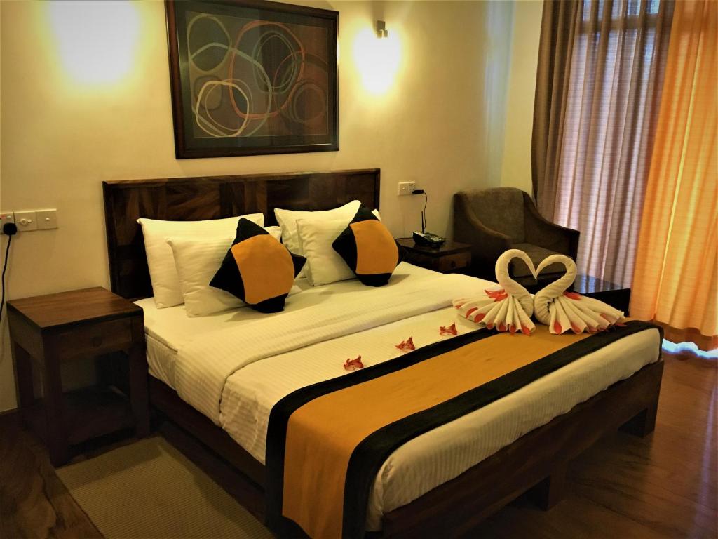 Postel nebo postele na pokoji v ubytování Spring Villas Kandy