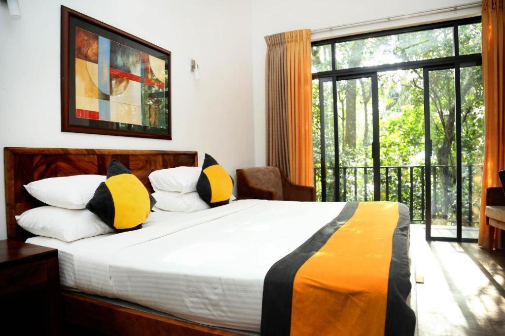 Postel nebo postele na pokoji v ubytování Spring Villas Kandy