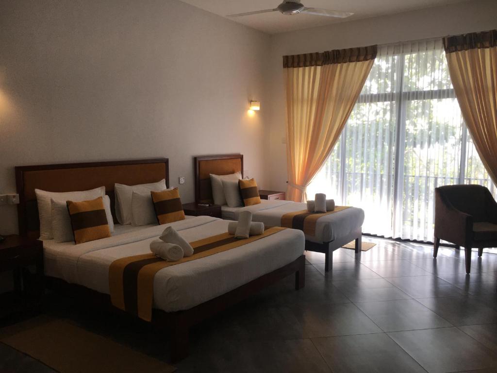 Postel nebo postele na pokoji v ubytování Spring Villas Kandy