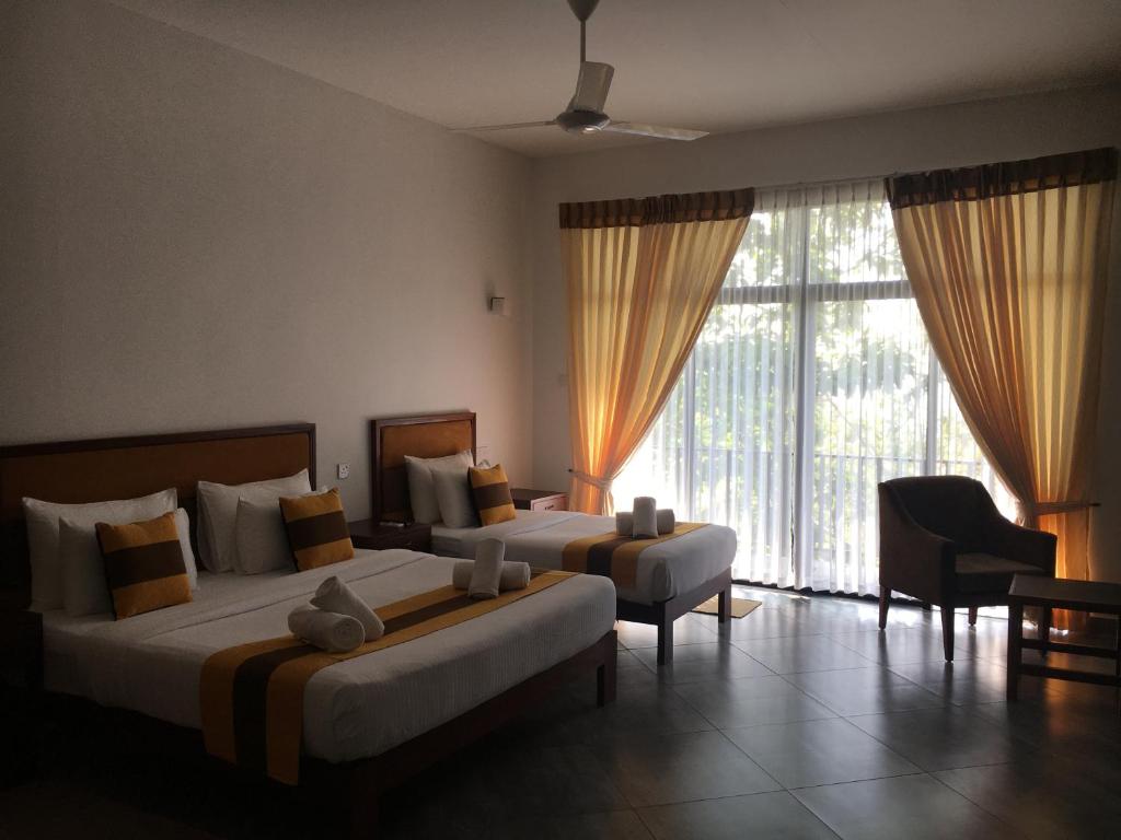 Postel nebo postele na pokoji v ubytování Spring Villas Kandy