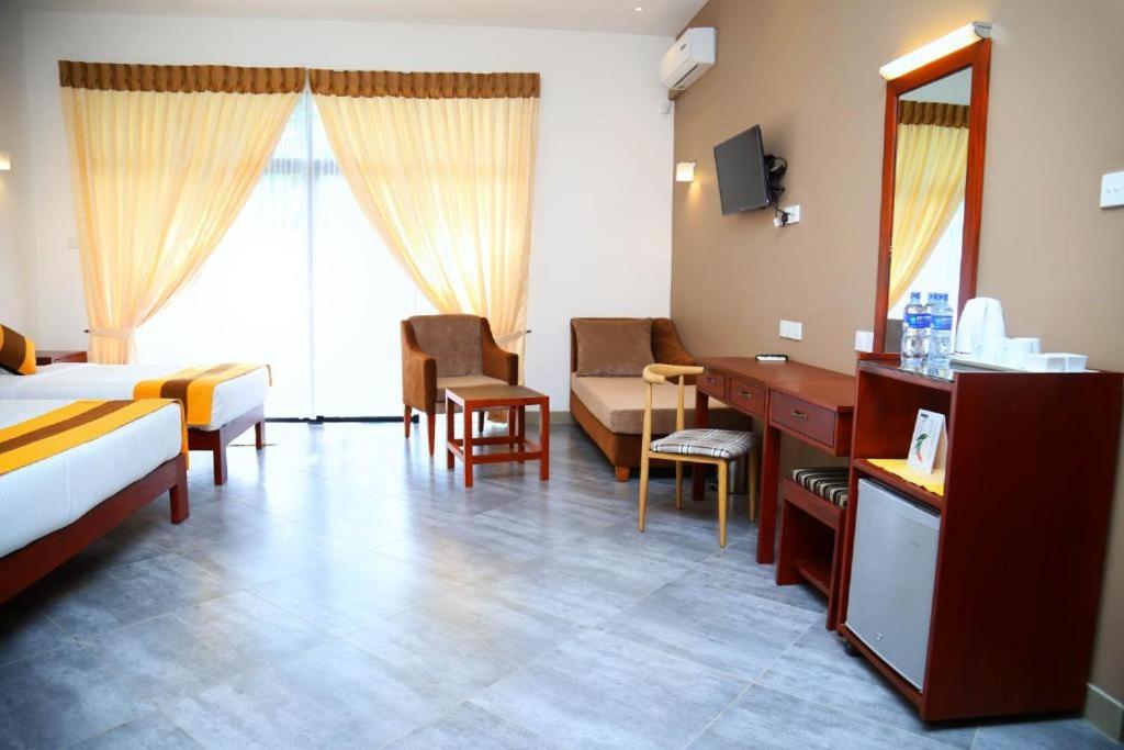 Postel nebo postele na pokoji v ubytování Spring Villas Kandy