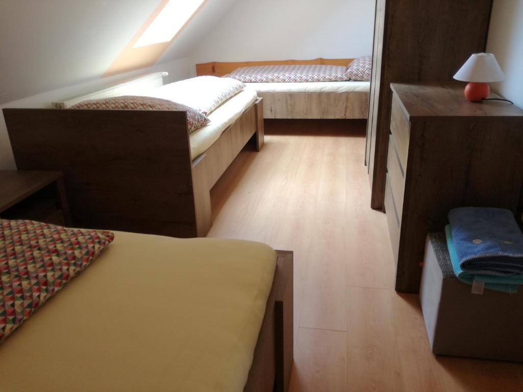 A bed or beds in a room at Apartmány Lenko - near thermal aquapark Tatralandia