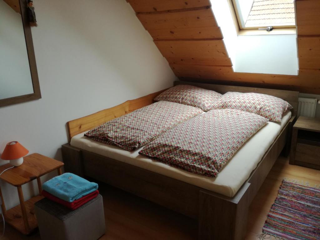 A bed or beds in a room at Apartmány Lenko - near thermal aquapark Tatralandia