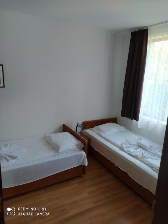 Postel nebo postele na pokoji v ubytování ARENA Apart Complex