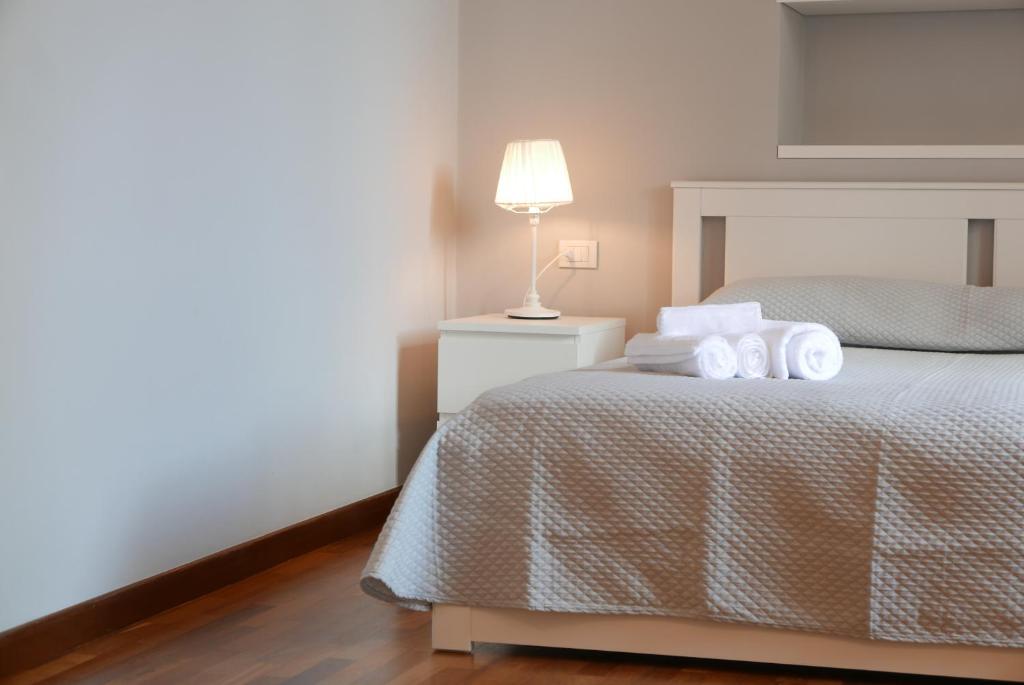 Łóżko lub łóżka w pokoju w obiekcie Suite 261 - intero appartamento nel centro di Bari