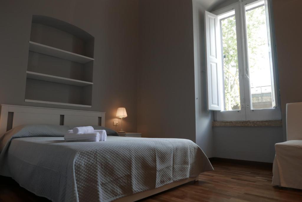 Łóżko lub łóżka w pokoju w obiekcie Suite 261 - intero appartamento nel centro di Bari
