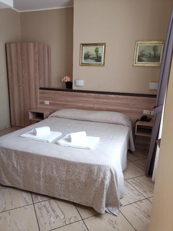 Postel nebo postele na pokoji v ubytování Hotel Brianza