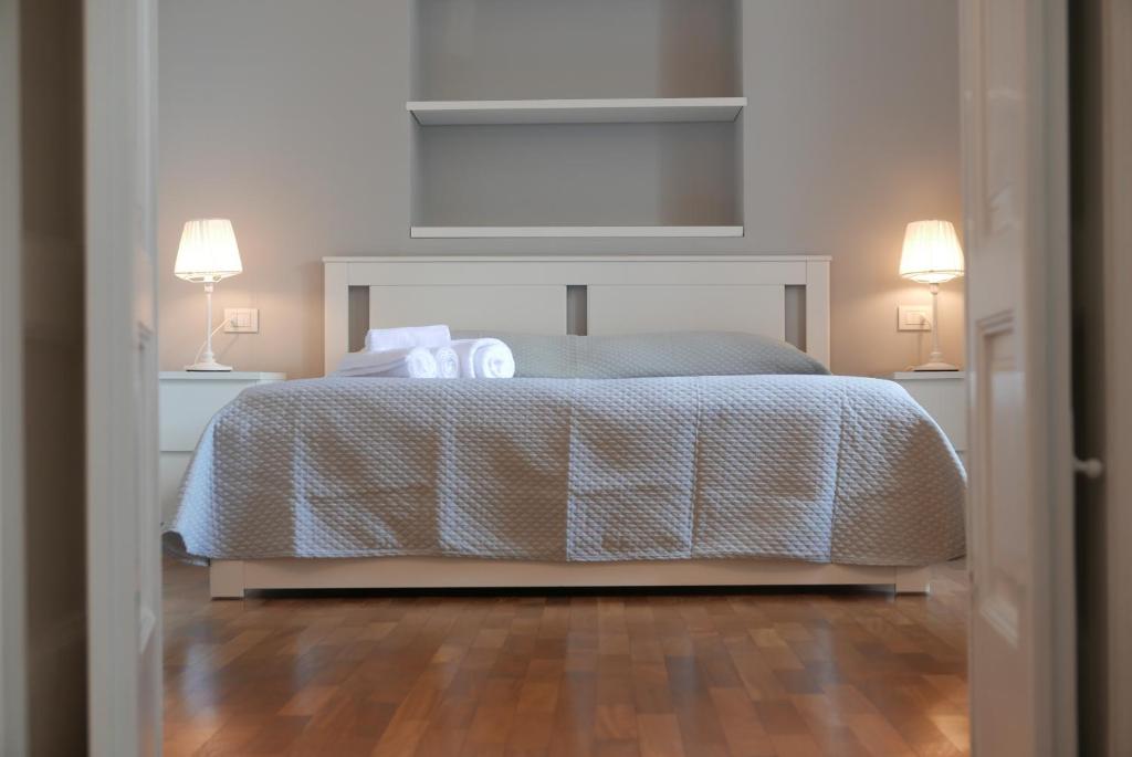 Łóżko lub łóżka w pokoju w obiekcie Suite 261 - intero appartamento nel centro di Bari