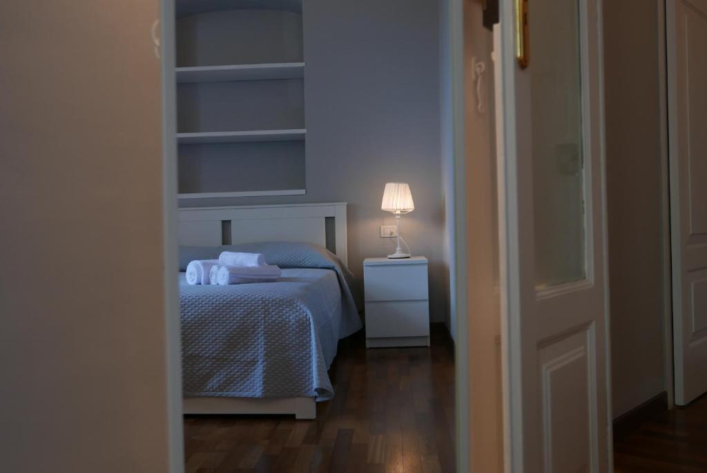 Łóżko lub łóżka w pokoju w obiekcie Suite 261 - intero appartamento nel centro di Bari