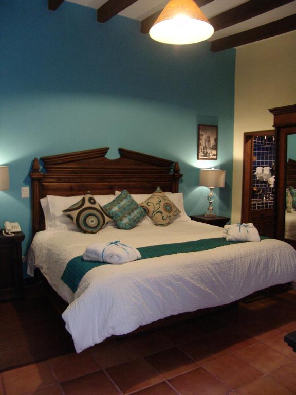 Postel nebo postele na pokoji v ubytování Casa del Tio Hotel Boutique