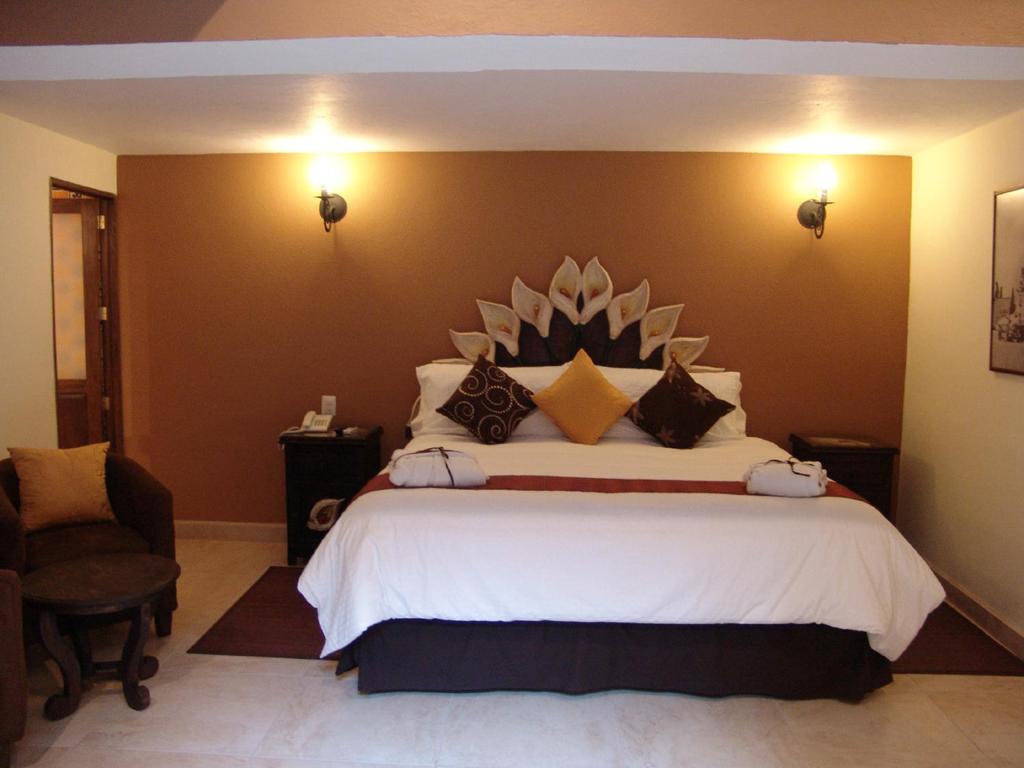 Postel nebo postele na pokoji v ubytování Casa del Tio Hotel Boutique