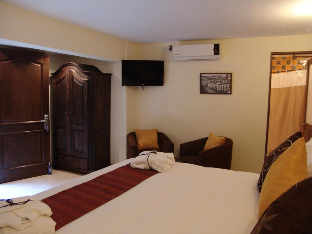 Postel nebo postele na pokoji v ubytování Casa del Tio Hotel Boutique