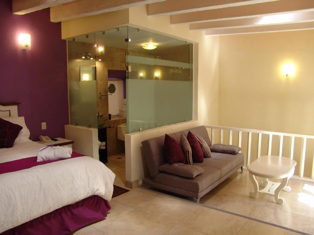 Postel nebo postele na pokoji v ubytování Casa del Tio Hotel Boutique