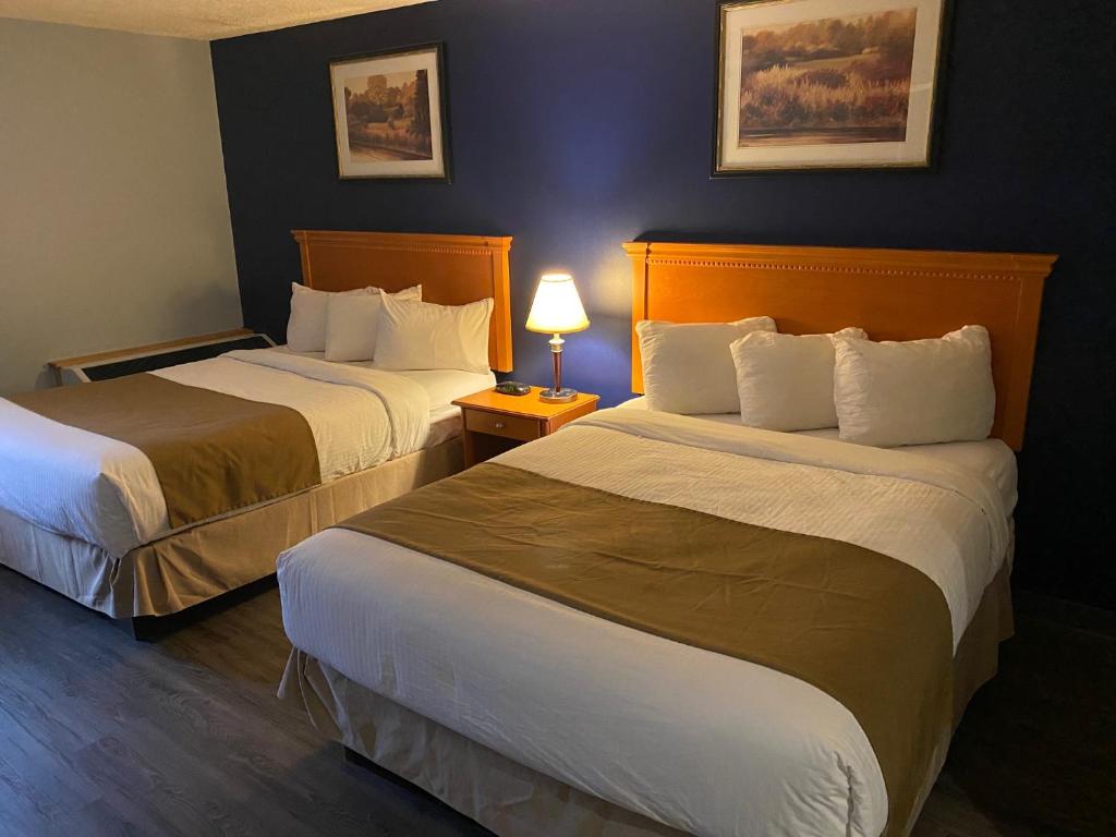 Postel nebo postele na pokoji v ubytování Northern Star Hotel & Convention Center
