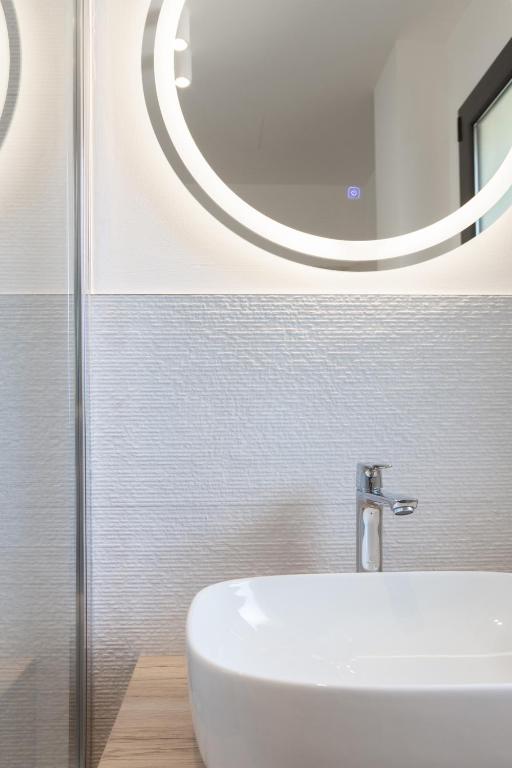 Koupelna v ubytování Renzo Hotel