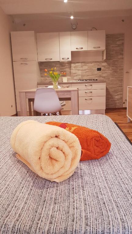 Łóżko lub łóżka w pokoju w obiekcie La Ca' d' Rina Casa Vacanze