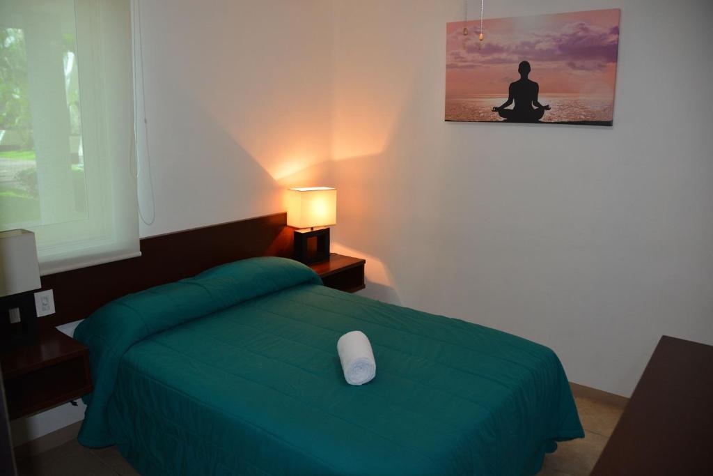 Postel nebo postele na pokoji v ubytování Zenharmony Suites