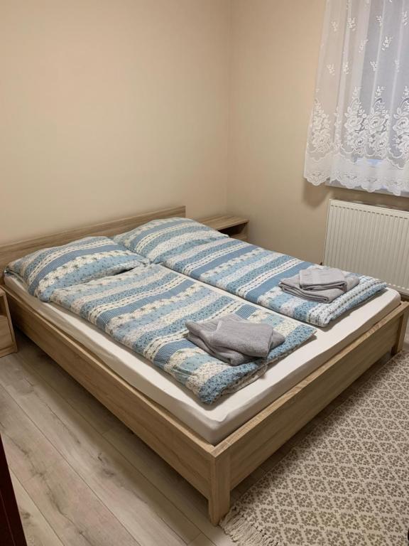 Postel nebo postele na pokoji v ubytování Apartmánový dom Magda