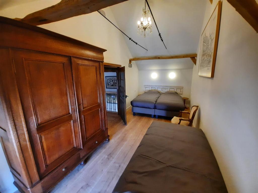 Postel nebo postele na pokoji v ubytování Het Stalhuys