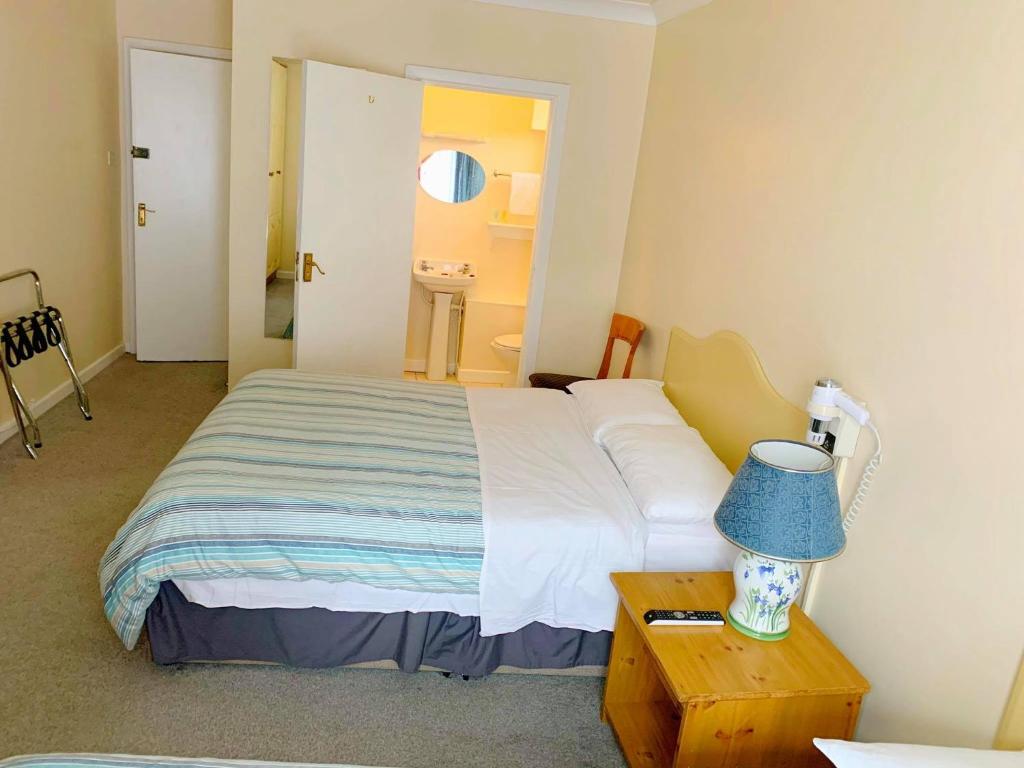 Postel nebo postele na pokoji v ubytování Redclyffe Guesthouse