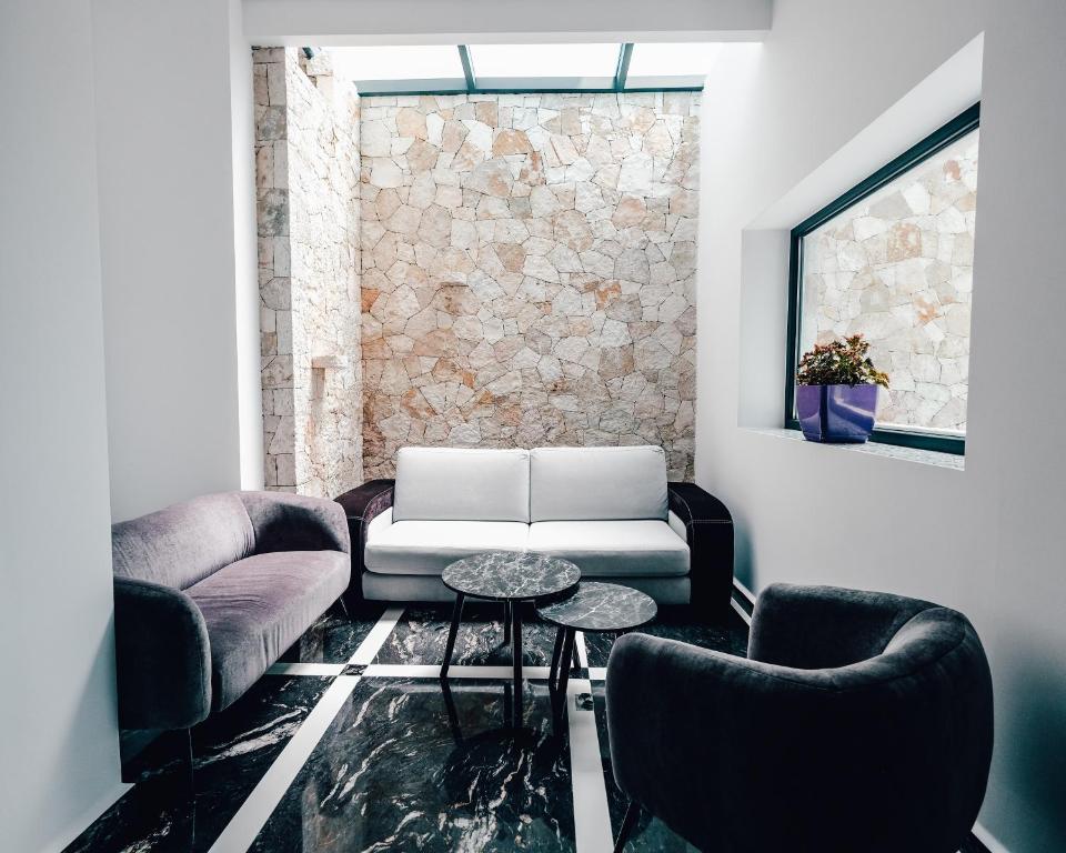 Posezení v ubytování El Primero Hotel