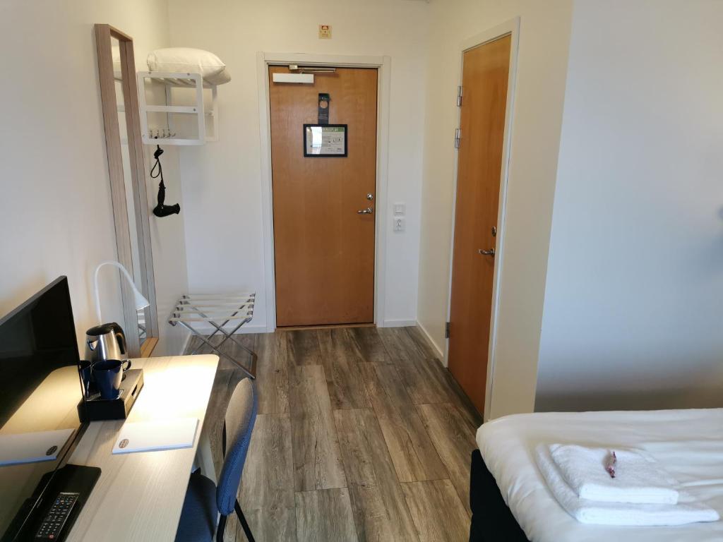 TV a/nebo společenská místnost v ubytování Kils Hotell & Restaurang