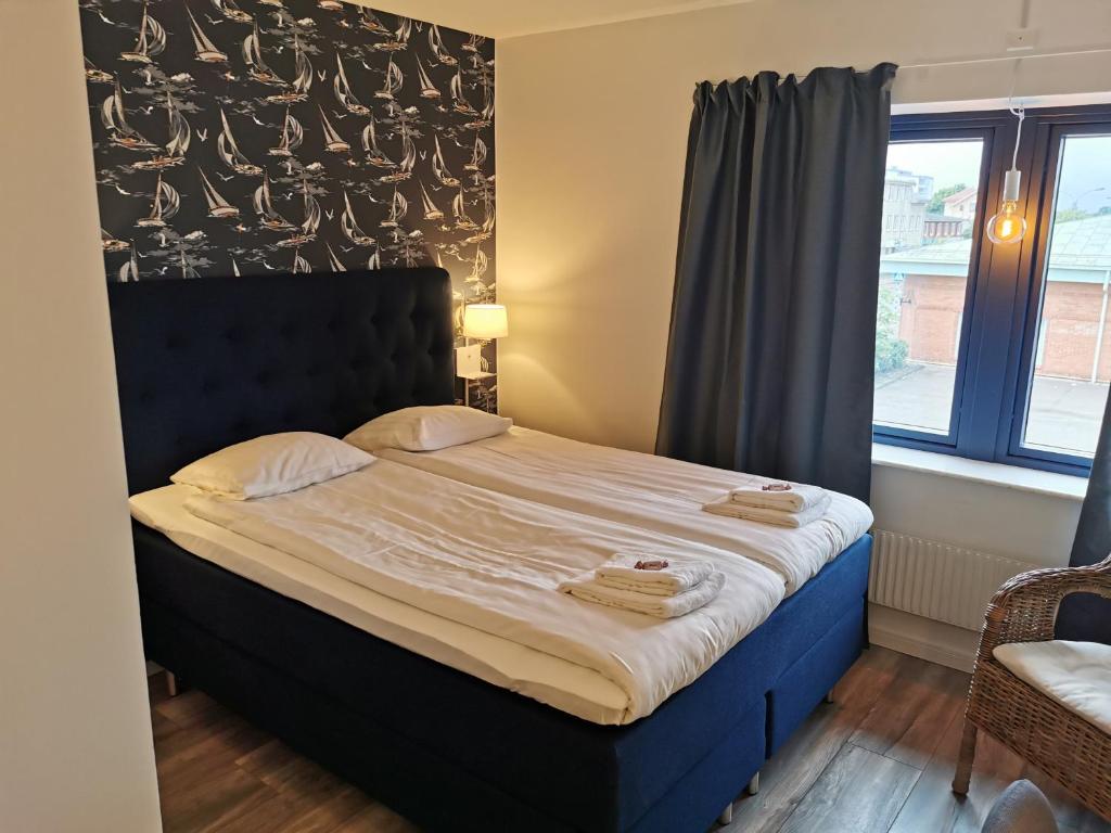 Postel nebo postele na pokoji v ubytování Kils Hotell & Restaurang