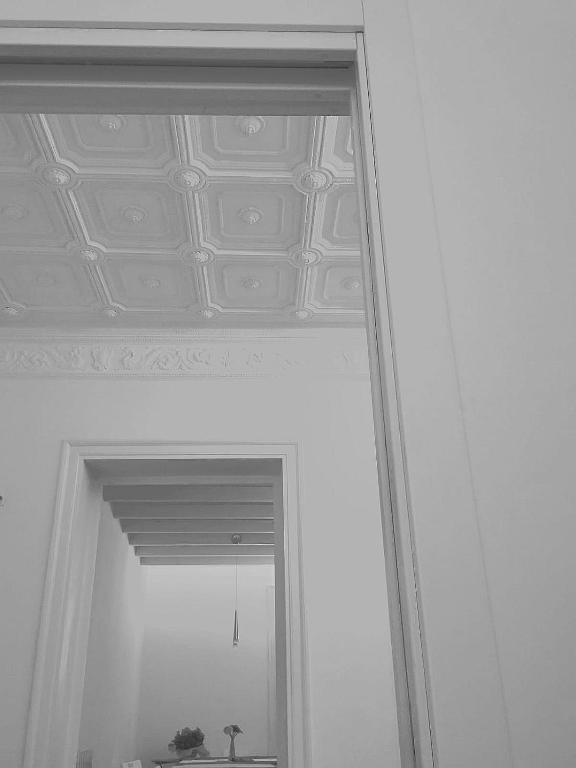 a mirror in a room with a ceiling at Casa Pirri in Palermo