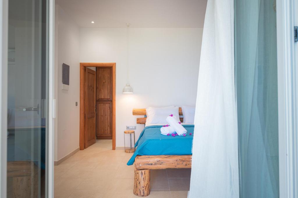 A bed or beds in a room at The Beach House Kaminaki