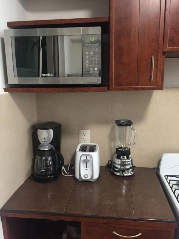 Kuchyň nebo kuchyňský kout v ubytování Zenharmony Suites