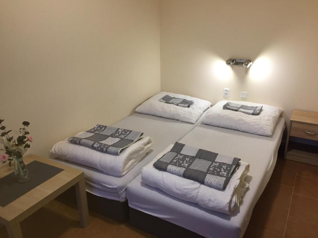 Postel nebo postele na pokoji v ubytování Oasis