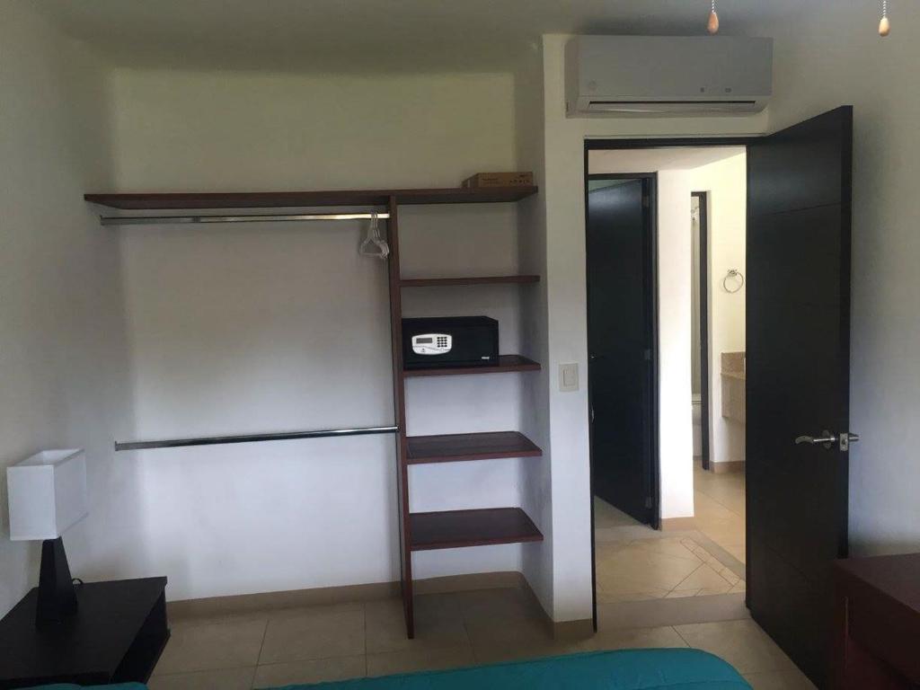 Postel nebo postele na pokoji v ubytování Zenharmony Suites