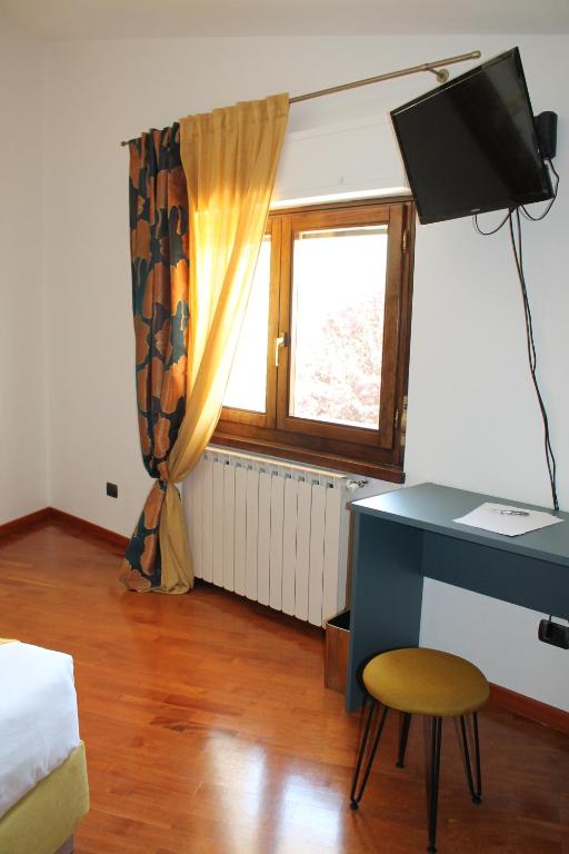 TV a/nebo společenská místnost v ubytování B&B La Casa di Sirio