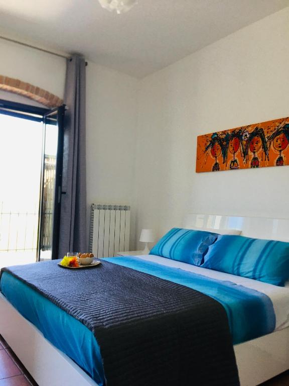 Posteľ alebo postele v izbe v ubytovaní La casa di Giulia Apartment with air conditioning, wifi and private parking
