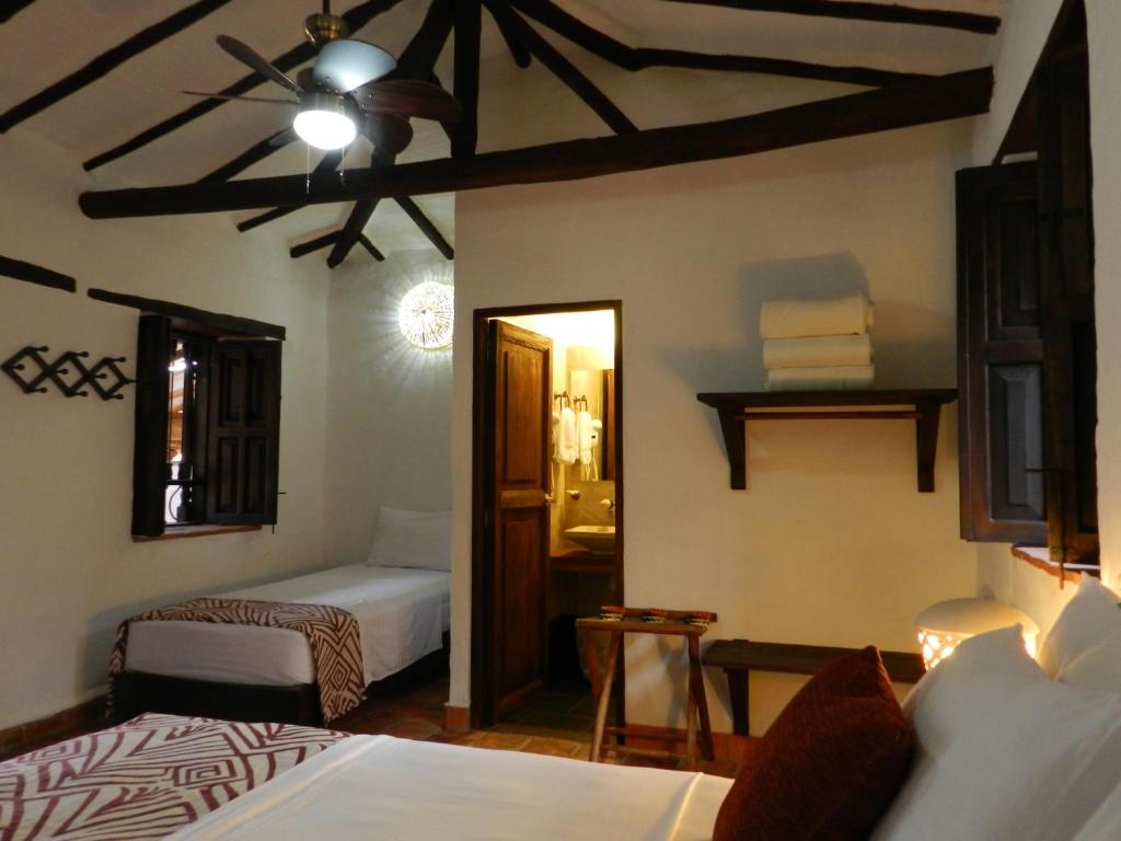 Postel nebo postele na pokoji v ubytování La Loma Hotel Barichara