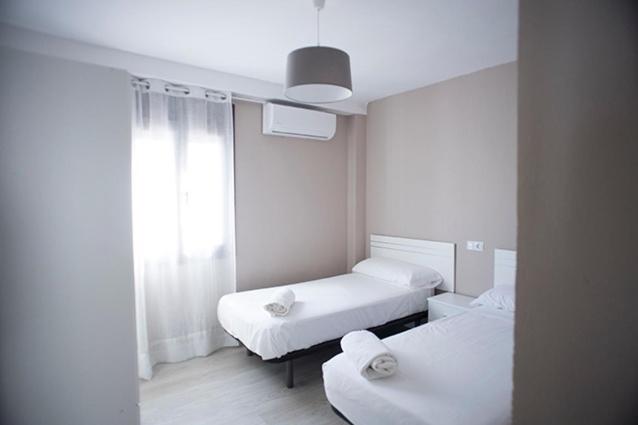 Postel nebo postele na pokoji v ubytování Apartamento Jardines de Cuenca