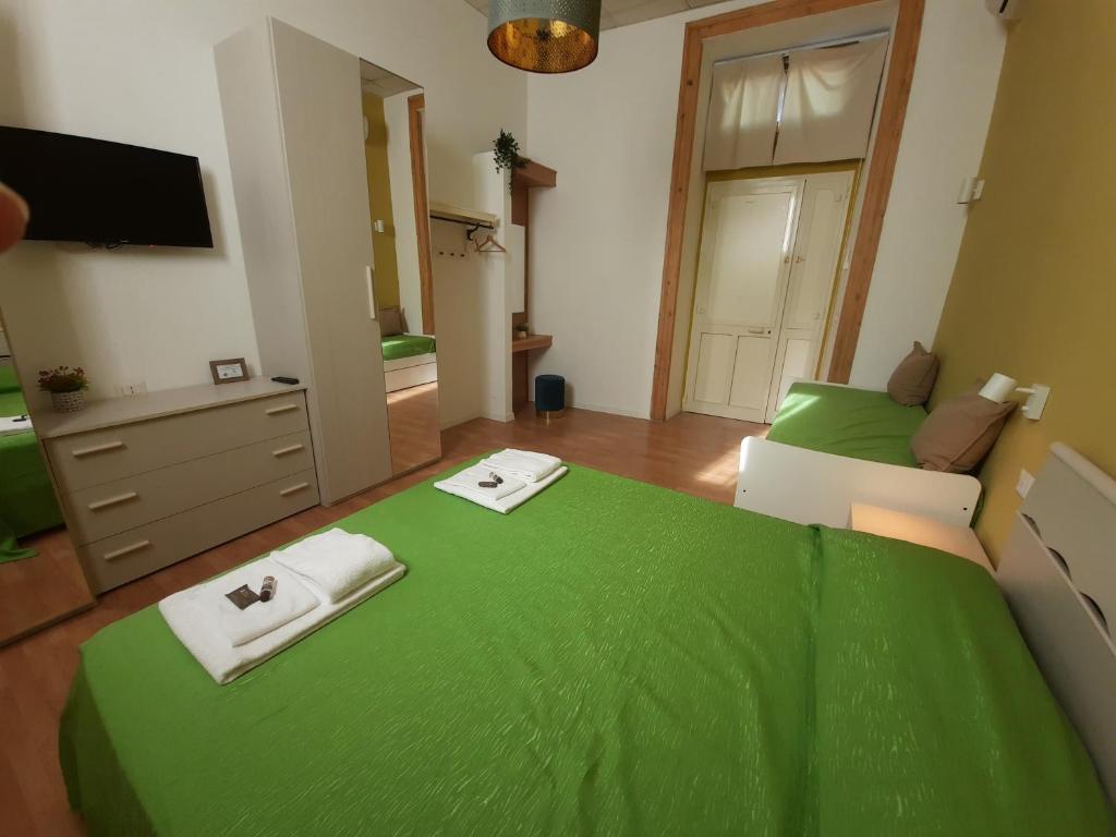 Posteľ alebo postele v izbe v ubytovaní BelloBello Rooms&Apartment