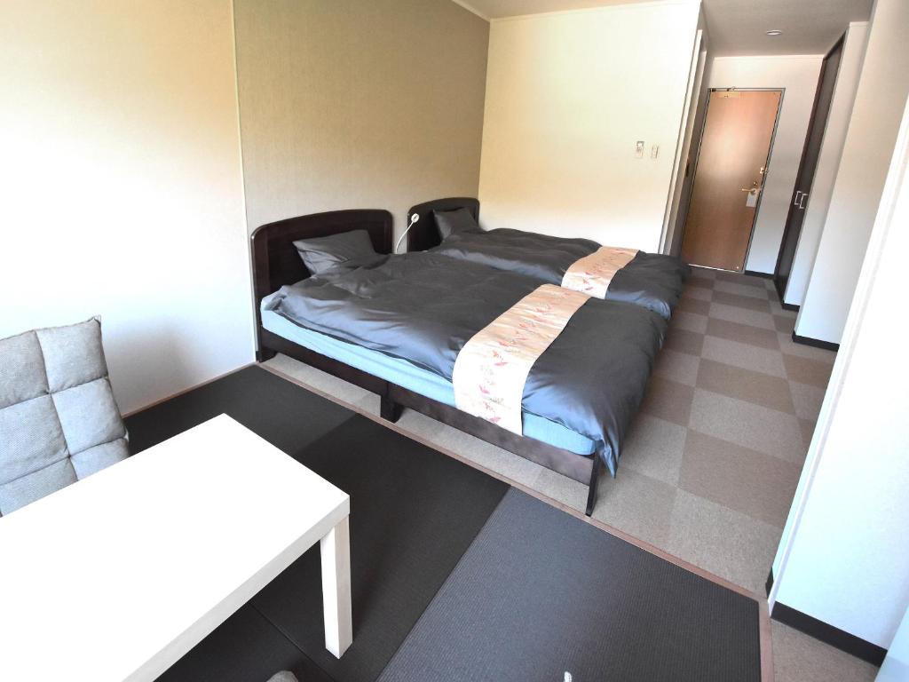 Postel nebo postele na pokoji v ubytování Field Hakone Resort