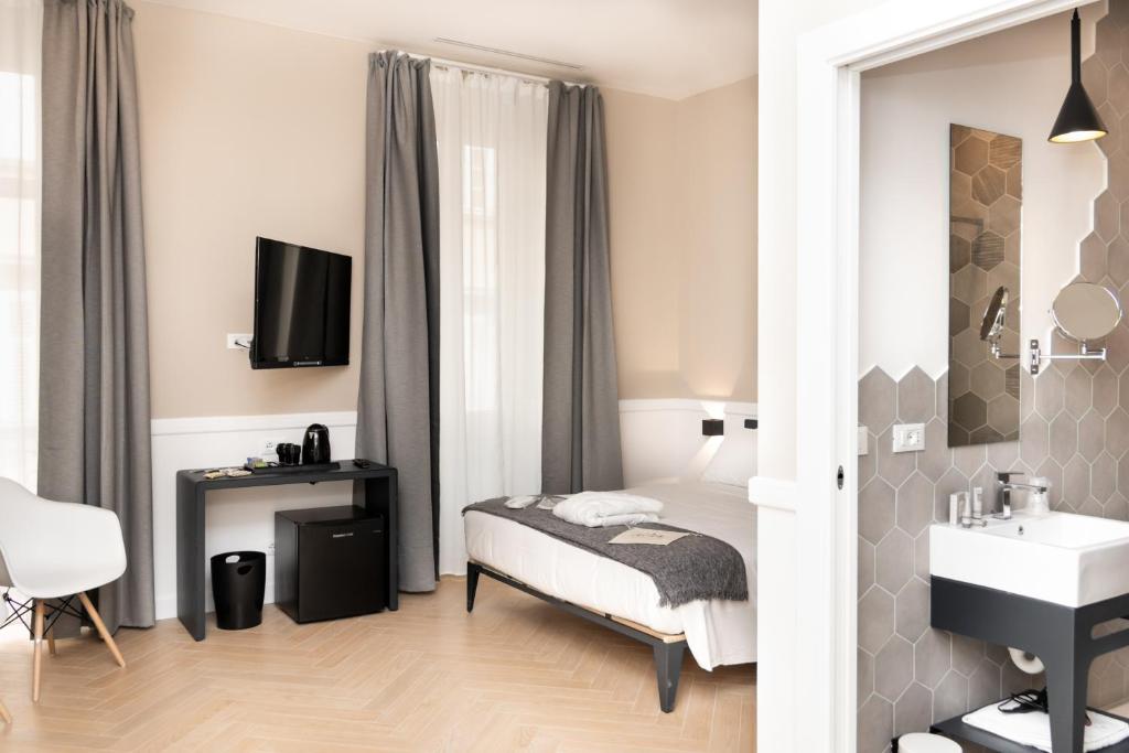 Łóżko lub łóżka w pokoju w obiekcie Elisabeth Boutique Rooms